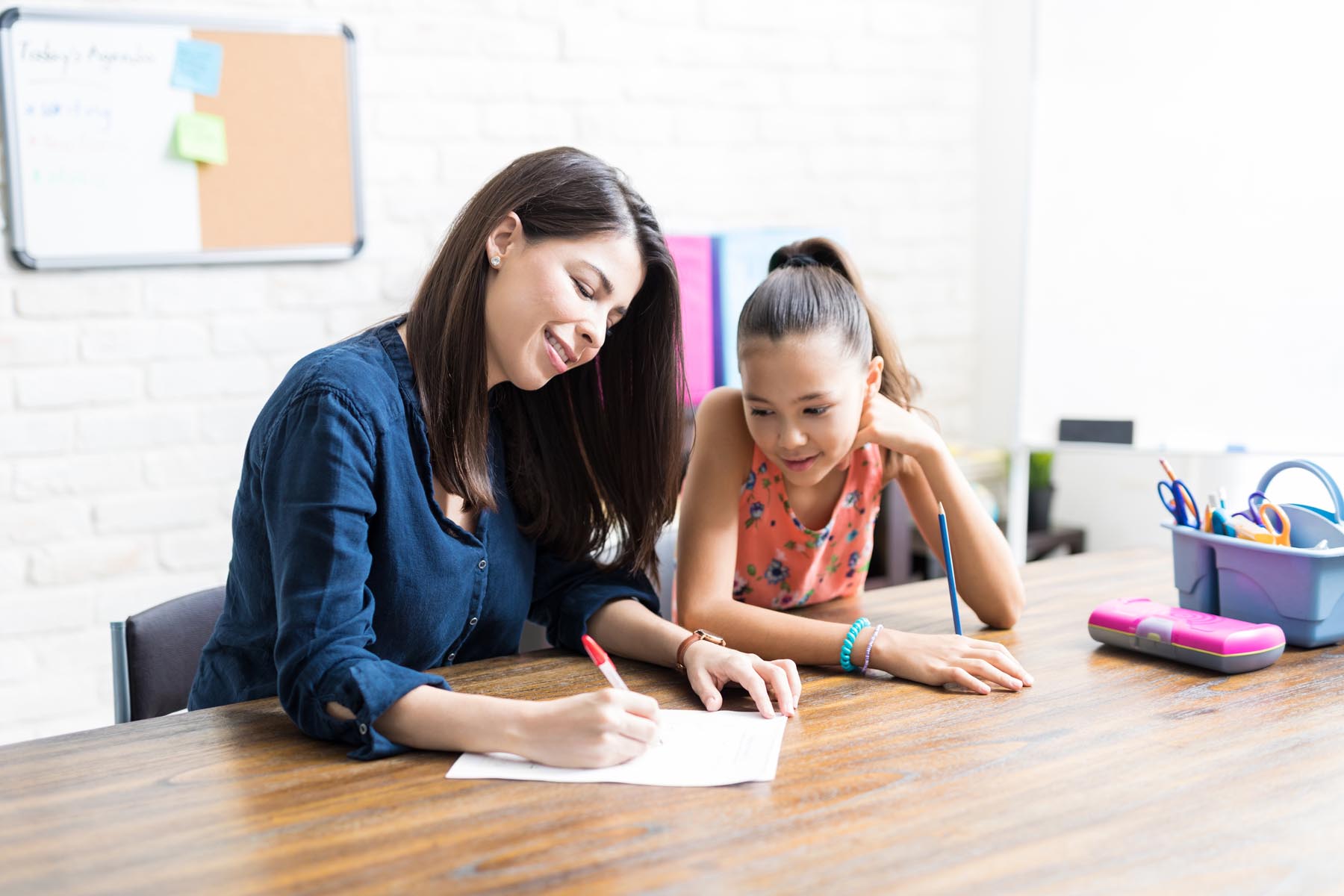 Happy student learning with tutor